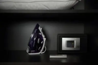 a phone sitting on a table next to a microwave at Hector Luxury Suite in Athens