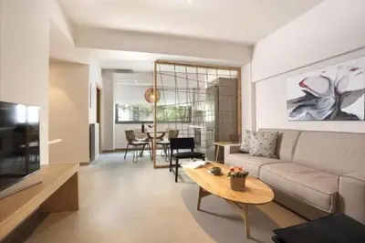 a living room with a couch and a table at Hector Luxury Suite in Athens