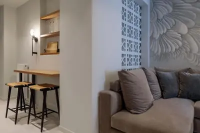 a living room with a couch and a table at Azalea Luxury Apartment in Athens