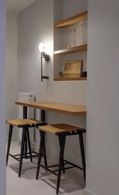 a desk and two stools in a room at Azalea Luxury Apartment in Athens