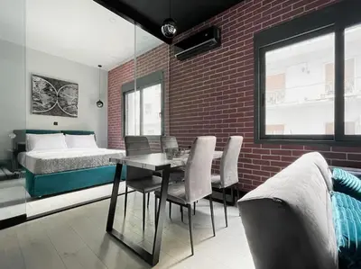 a bedroom with a bed and a table and chairs at Lucky New Home #01 VIPGreece in Athens