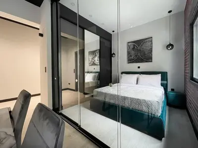 a bedroom with a bed and a glass wall at Lucky New Home #01 VIPGreece in Athens