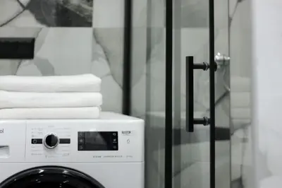a washing machine with towels on top of it at Lucky New Home #01 VIPGreece in Athens