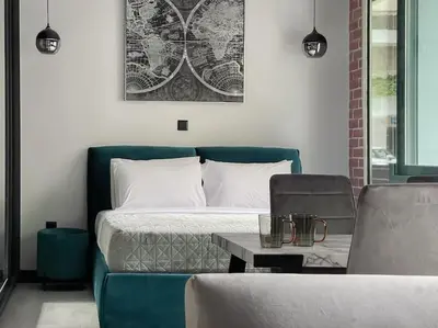 a bedroom with a bed and a couch and a table at Lucky New Home #01 VIPGreece in Athens