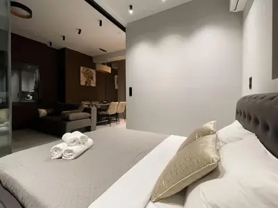 a bedroom with a bed with towels on it at Lucky Central Home #22 VIPGreece in Athens