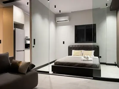 a bedroom with a bed and a large mirror at Lucky Central Home #22 VIPGreece in Athens