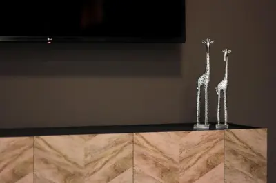 two metal giraffe statues sitting on top of a table at Lucky Central Home #22 VIPGreece in Athens