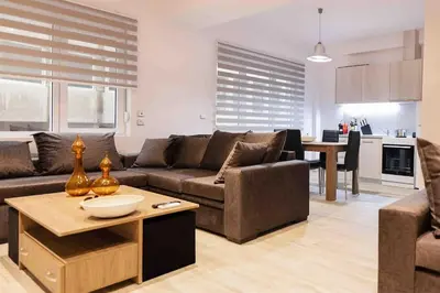 a living room with a couch and a table at FKVILLAS-K-1 in Piraeus