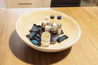 a bowl filled with bottles of alcohol on a table at FKVILLAS-K-1 in Piraeus