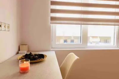 a dining room table with a plate of food and a window at FKVILLAS-K-1 in Piraeus