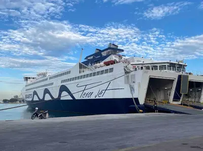 a large cruise ship is docked at a dock at FKVILLAS-K-1 in Piraeus