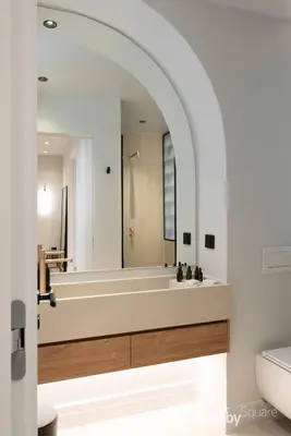 a bathroom with a tub and a large mirror at Muse Apartment by LobbySquare in Athens