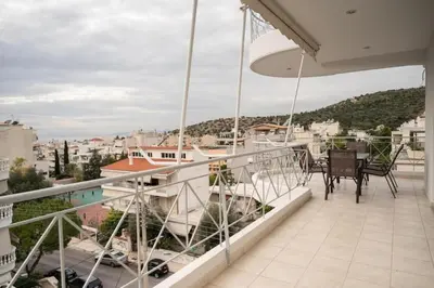 a balcony with a table and chairs on it at Breathtaking view apartment in Glyfada (AS_D1) in Athens