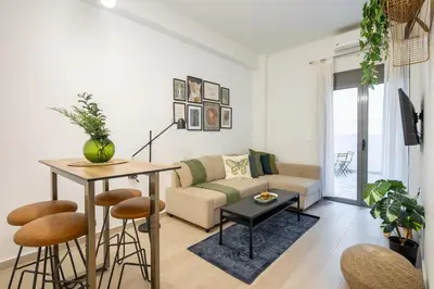 a living room with a couch and a table at Zappa 2-Bedroom Apartment in Athens in Athens