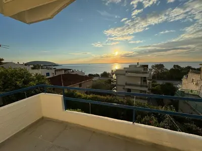 a view of the ocean from a balcony at Traditional Seaview Maisonette in Saronida