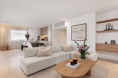 a living room with a white couch and a table at 2-BDR SV Elegance Luxury Apt with Shared pool in Athens