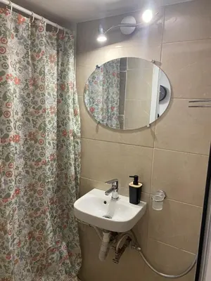 a bathroom with a sink and a mirror at Syntagma studio in Athens