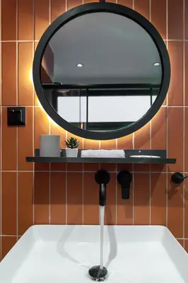 a bathroom with a sink and a mirror at Bonnie Athens by Nin&Bau in Athens