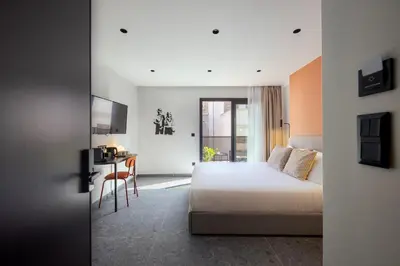 a hotel room with a bed and a desk at Bonnie Athens by Nin&Bau in Athens