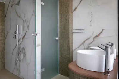 a bathroom with a sink and a shower at Hestia - Kolokotroni 23 in Athens