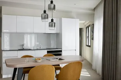 a kitchen with a wooden table and chairs at Hestia - Kolokotroni 23 in Athens