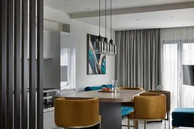 a kitchen and dining room with a table and chairs at Hestia - Kolokotroni 23 in Athens