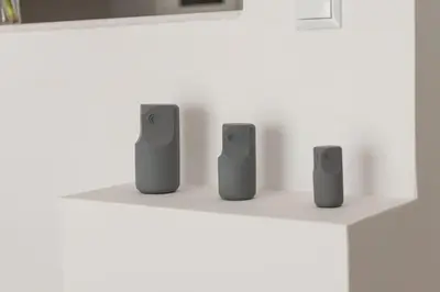 four devices sitting on a white shelf at The Acropolis dream house in Athens