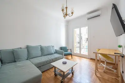 a living room with a couch and a table at Zen Exaricha in Athens
