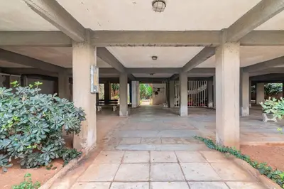 an empty hallway of a building with pillars at VARKIZA APARTMENT in Varkiza