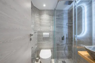 a bathroom with a toilet and a shower at Newly Renovated Escape/Psychiko in Athens