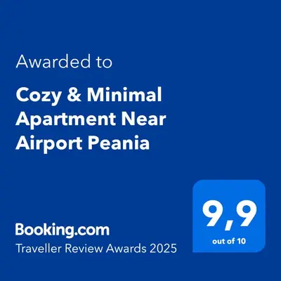 a blue sign with the text awarded to cozy minimal apartment near airport penna at Cozy & Minimal Apartment Near Airport Peania in Paianía
