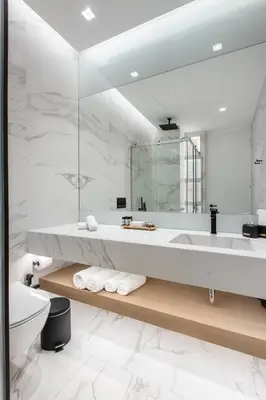 a white bathroom with a tub and a sink at Nsplace in Athens