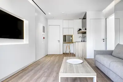 a living room with a couch and a table at Nsplace in Athens