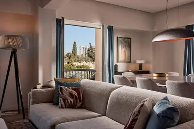 a living room with a couch and a table at Acropolis Grand Suite in Athens