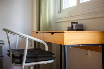 a chair sitting at a desk in a room at Socrates 1-Bedroom Apartment in Athens in Athens