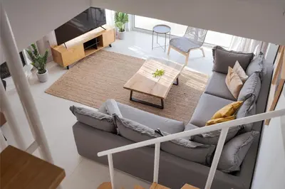 a living room with a couch and a table at Athenian Riviera Panorama Villa in Athens