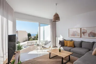 a living room with a couch and a table at Athenian Riviera Panorama Villa in Athens