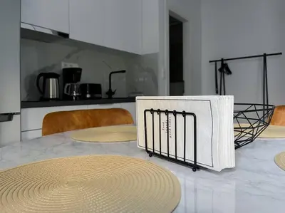 a table with mats on it in a kitchen at Lucky Premium Home #11 VIPGreece in Athens