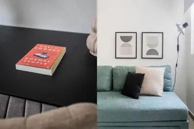 a book and a couch in a living room at Faliro Sunlit 3BR Apartment by UPSTREET in Athens