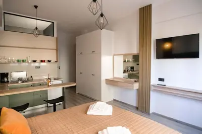 a room with a bed and a kitchen with a counter at Athinas Relax G1 in Athens