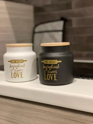 two candles sitting on a shelf next to each other at Aiolos apartment alimos centre 4 near the sea in Athens