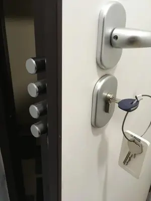 a door with a lock with a key plugged into it at Studio close to Athens centre, fast internet. in Athens