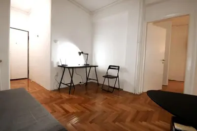 a room with a table and a chair in it at Studio close to Athens centre, fast internet. in Athens