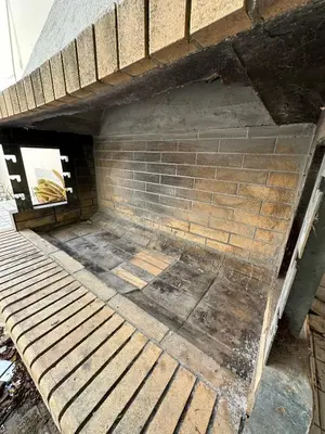 a building with a brick wall and wooden steps at Villa in Voula 5 mins from the Beach in Athens