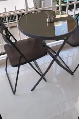 a glass table and two chairs around a glass table at Α&J Sweet Home in Athens