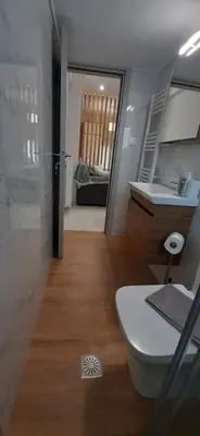 a bathroom with a toilet and a sink in a room at Α&J Sweet Home in Athens