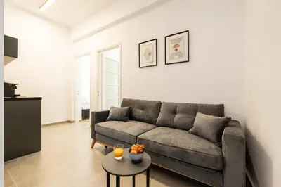 a living room with a couch and a table at Ranny House in Athens