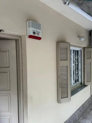 a window and an air conditioner on the side of a building at Cozy home in Nea Smirni in Athens