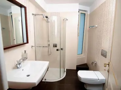 a bathroom with a sink and a shower and a toilet at Luxurious Family friendly Villa Anavyssos in Anavissos