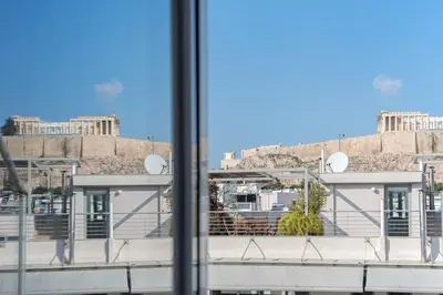 a view of the acropolis from a window at Parthenon crown penthouse in Athens